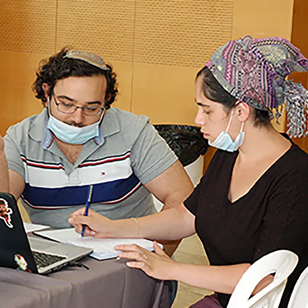 Two students in the Faculty of Engineering at Bar Ilan University sit and work on an article